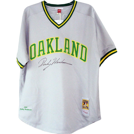 Rickey Henderson Signed Grey Throwback A?€™s Jersey (Signed on Front)