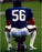 Lawrence Taylor Sitting on Football and Helmet Vertical 16x20 Photo