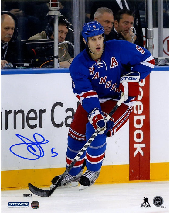 Dan Girardi Signed Skating with Puck 8x10 Photo