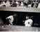 Yogi Berra w/ Elston Howard in Dugout B&W Horizontal 16x20 Photo (Signed by Regan) (MLB Auth)