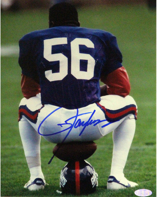 Lawrence Taylor Sitting on Football and Helmet Vertical 8x10 Photo