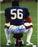 Lawrence Taylor Sitting on Football and Helmet Vertical 8x10 Photo