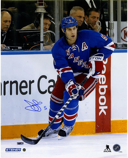 Dan Girardi Signed Skating with Puck 16x20 Photo