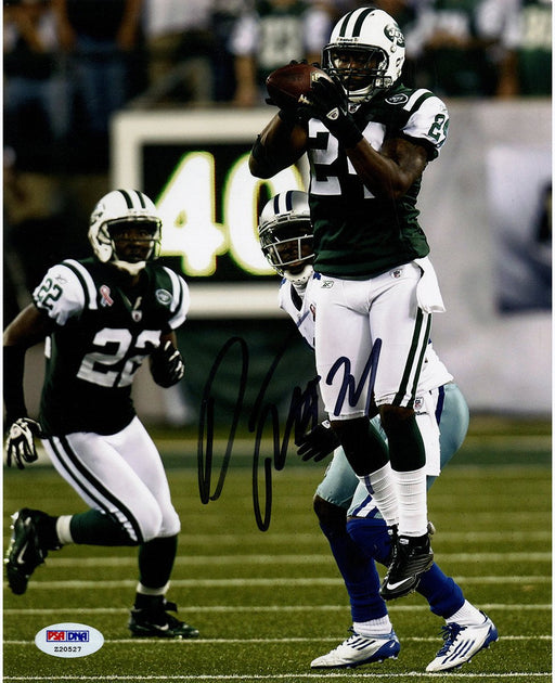 Darrelle Revis Signed Intercepting Football vs. Cowboys 8x10 Photo (Signed in Black) 8x10 Photo ( PSA/DNA Auth)