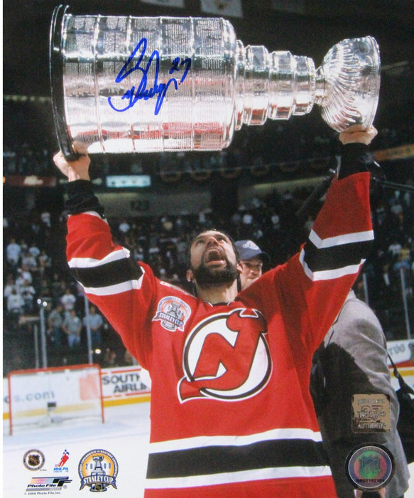 Scott Niedermayer Signed Holding 2000 Stanley Cup Overhead Vertical 8x10 Photo (Niedermayer Auth)