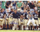 Charlie Weis Yelling from Sidelines with Team in the Background 8x10 Photo